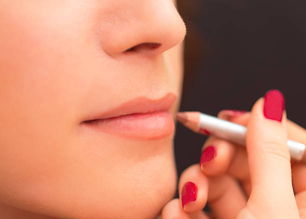 istock Applying lip products on a woman face. 515231166
