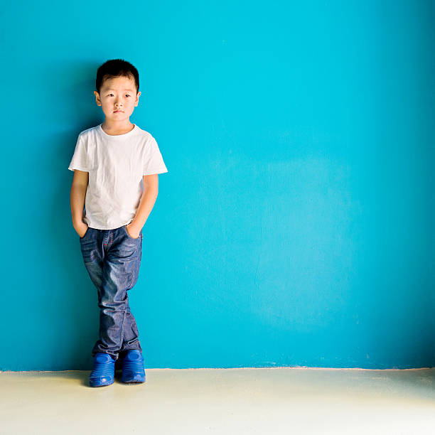 istock Chinese little boy against wall 515231348