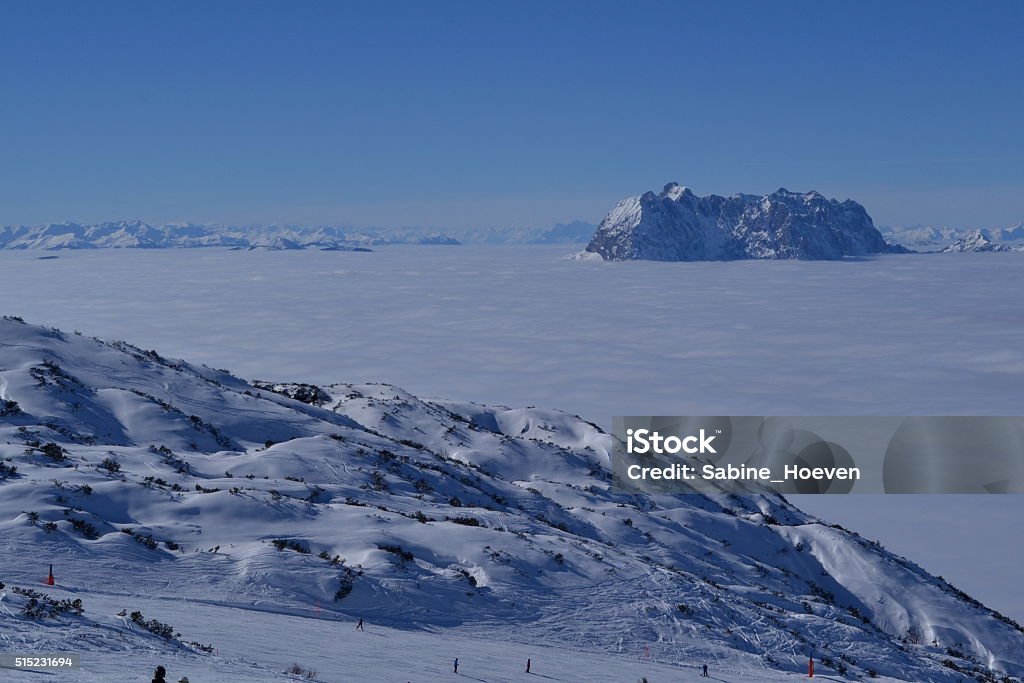 Mountains and clouds Mountains in the clouds, mountainpeak above clouds Above Stock Photo