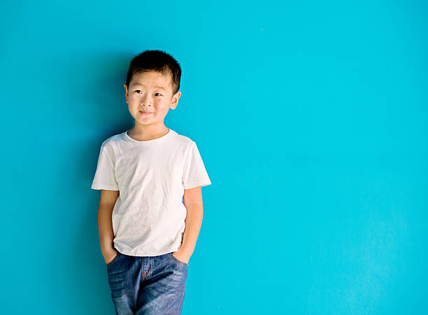 istock Chinese little boy against wall 515231758