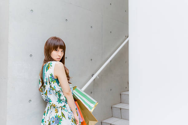 istock Japanese girl waiting for someone at steps 515232138