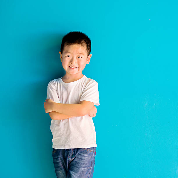 istock Chinese little boy against wall 515233094