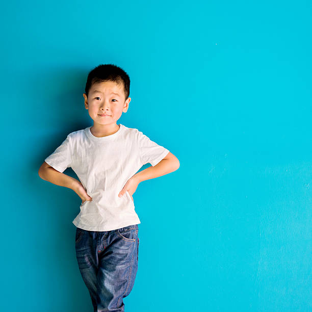 istock Chinese little boy against wall 515233334