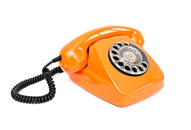istock Orange retro telephone isolated on white background. 515234290