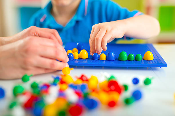 istock Boy playing with educational toys on a table 515235150