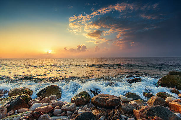 istock Tropical colorful sunrise at the stones beach. 515235320