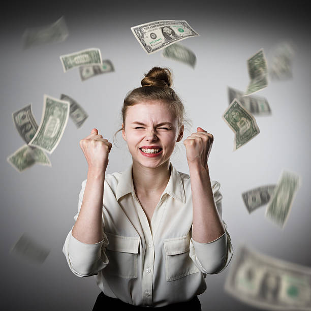 istock Rejoicing. Girl in white and dollars. 515236866