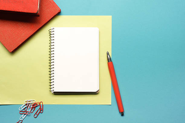 istock Office desk table with supplies and crumpled paper. Top view 515237394