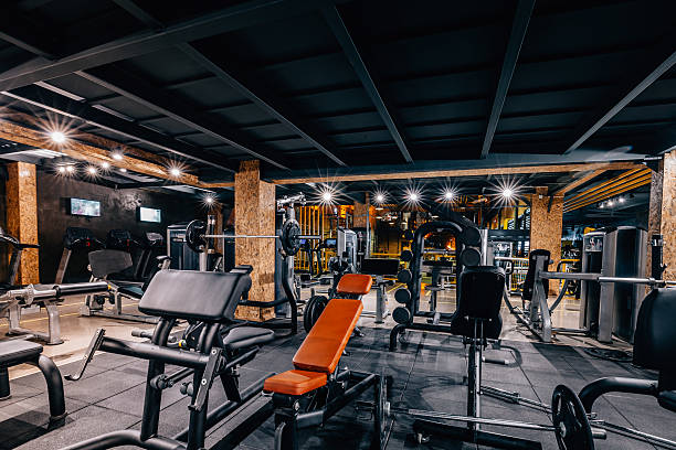 Modern and Big Gym Empty modern and big health and recreation gymnasium club center room with sports equipment health club stock pictures, royalty-free photos & images