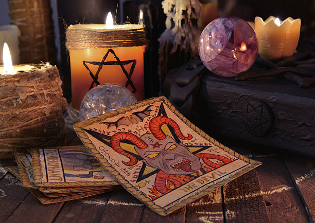 istock Old tarot cards with candles and book 515238670