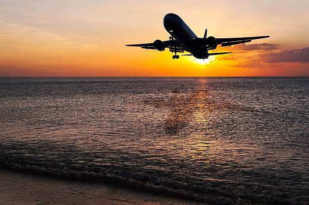 istock Beach with plane on color of the sunset 515238874