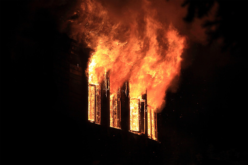 The bright flames in the darkness, pulled out of the four windows