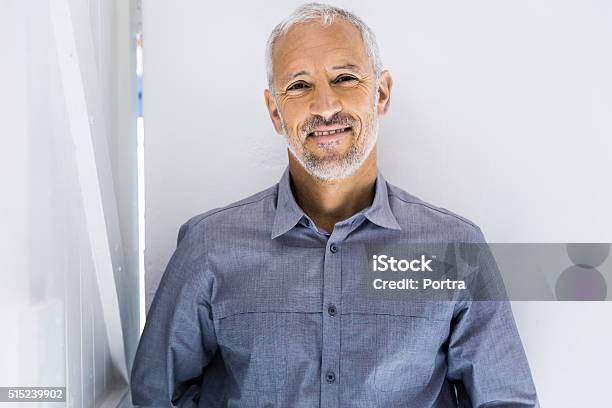 Confident Businessman Smiling In Office Stock Photo - Download Image Now - Men, 45-49 Years, Portrait