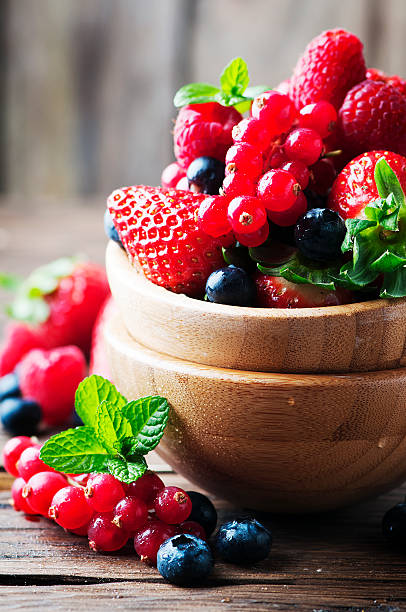 istock Mix of berry on the wooden table 515239908