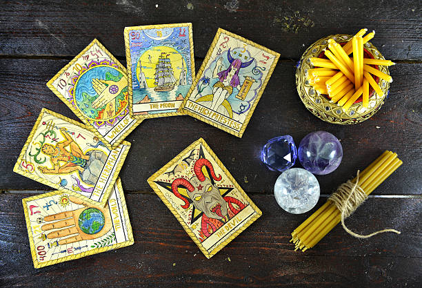 Background with candles, crystal and tarot cards stock photo