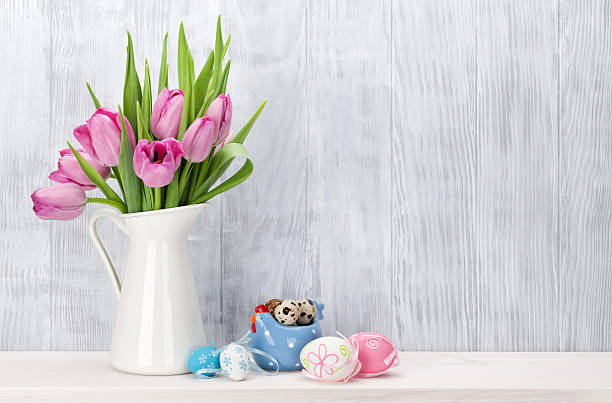 istock Easter eggs and pink tulips bouquet 515240260
