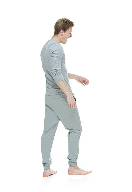 istock Young adult male yawning & walking 515243713