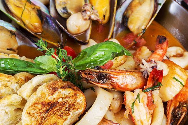 istock seafood cocktail, calamari, mussels, shrimp. background 515244239