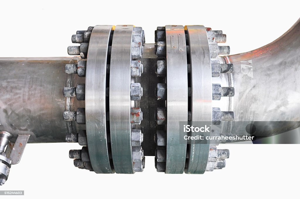 Metal pipe flanges with bolts on an isolated background Metal pipe flanges with bolts on an isolated background, Pipe line in oil and gas industry and installed in plant or process. Steel Stock Photo