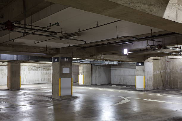 istock Parking garage underground interior, neon lights in dark 515245783
