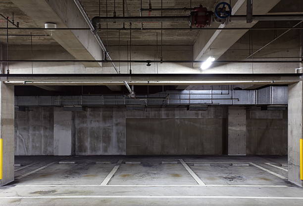 istock Parking garage underground interior, neon lights in dark 515245875