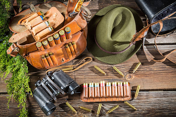 Bag, bullets and hat in a hunting lodge.