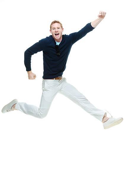 istock Cheerful casual man jumping & cheering 515246303