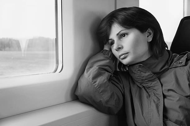 istock Young woman traveling by train 515247393