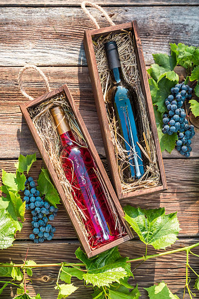 istock Wines in a wooden box and grapes 515258535