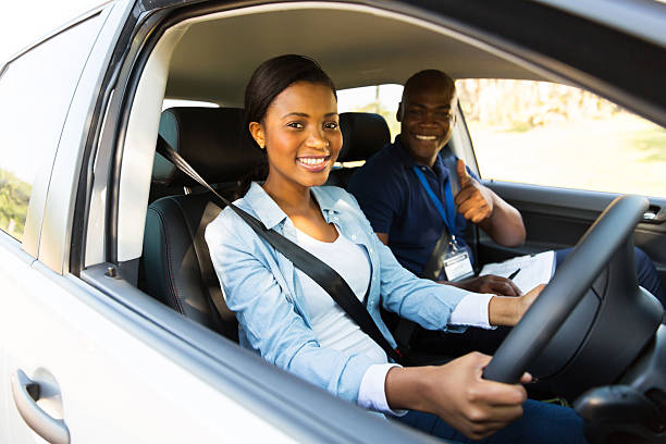 istock young african woman taking driving lessons 515259731