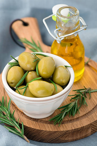 istock Olives with rosemary in a ceramic bowl 515259753