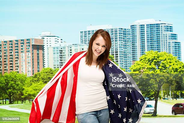 Happy Female Outdoors With American Flag Stock Photo - Download Image Now - 20-24 Years, 20-29 Years, Adult