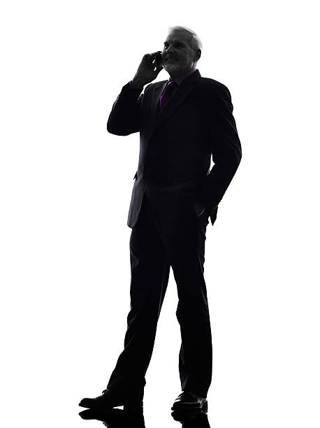 istock senior business man on the telephone smiling silhouette 515260441