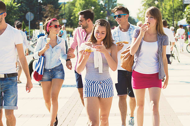 istock Group of friends walking and eating 515262302