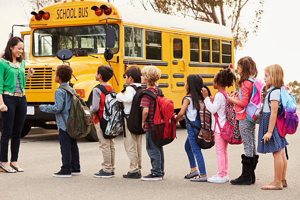 istock Teacher and a group of elementary school kids at a 515262588