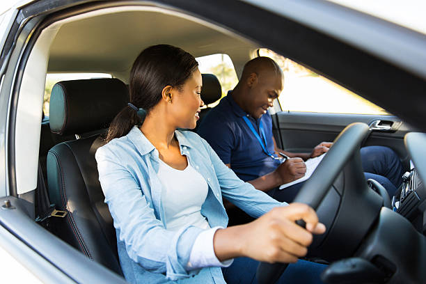 istock african girl taking driving lessons 515262691
