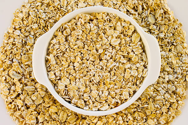 istock Oat flakes in a white mini pot 515263016