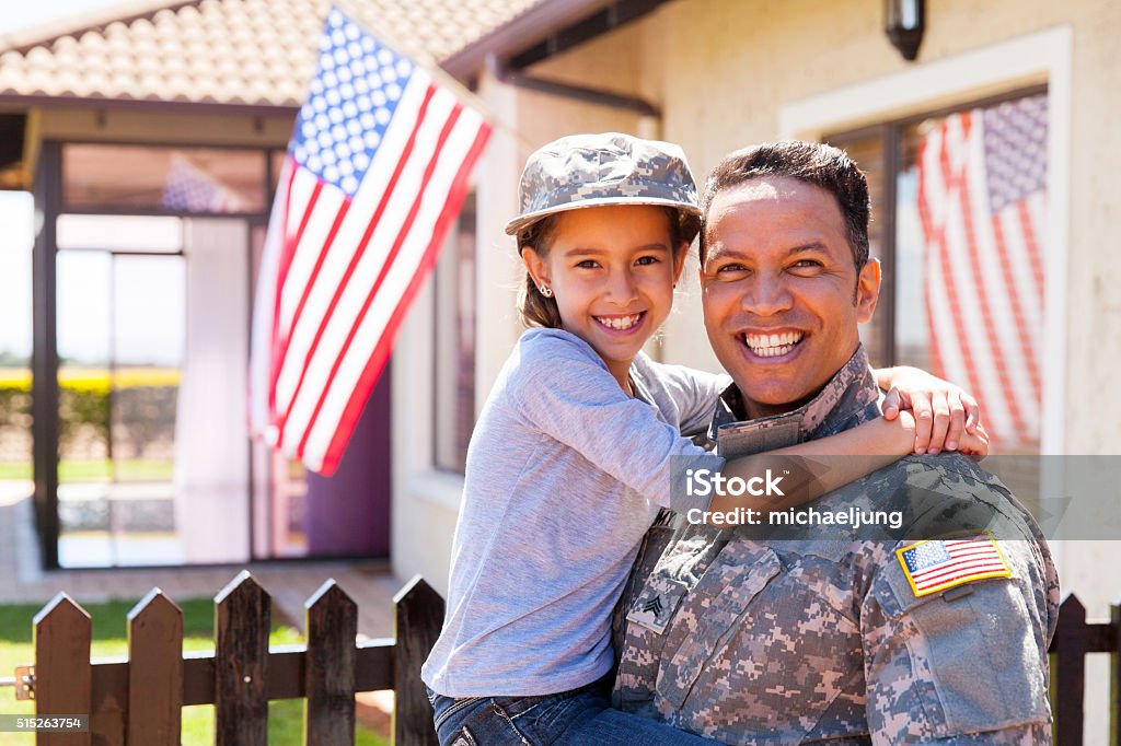 us army soldier and little daughter portrait of us army soldier and little daughter outside their home Veteran Stock Photo