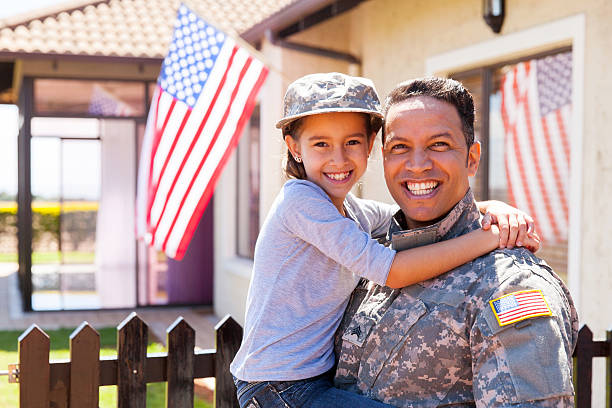 us army soldier and little daughter stock photo