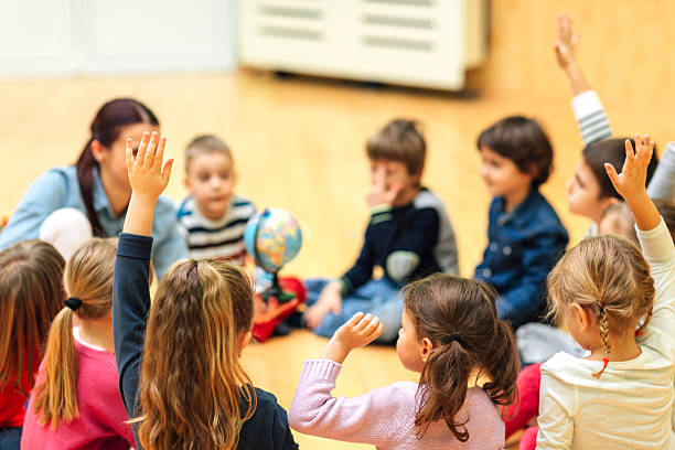 istock Preschool teacher and children in classroom 515263962