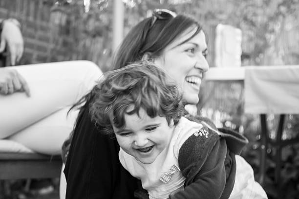 istock Mummy and daughter having fun. Blur effect. Black and white. 515265430