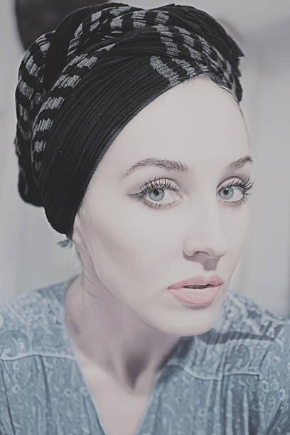 istock woman wearing headscarf 515265878