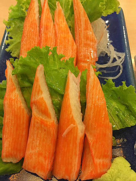 istock Crab stick on blue dish with wasabi on warm light 515266202