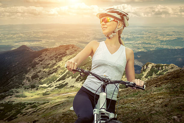 istock woman stay on the bicycle around 515266348