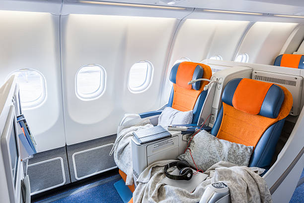 istock two chairs prepared to sleep in the airplane salon (horisontal) 515267936