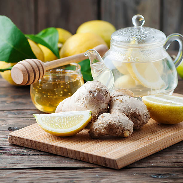 istock Cocktail with ginger, lemon and honey on the wooden table 515269884
