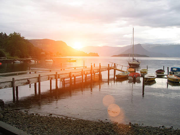 istock Norway fjord harbor boats sunset 515270534