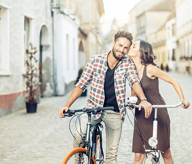 istock handsome young man on bikes is kiss on the cheek 515271324