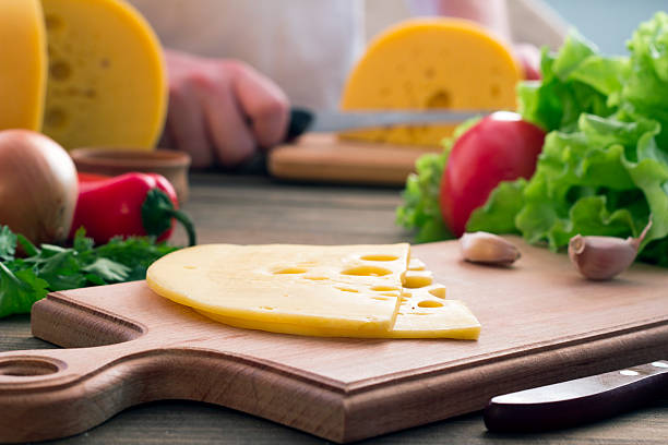 Slice of cheese , vegetables, herbs Slice of cheese , vegetables, herbs  on a cutting board sandwich new hampshire stock pictures, royalty-free photos & images