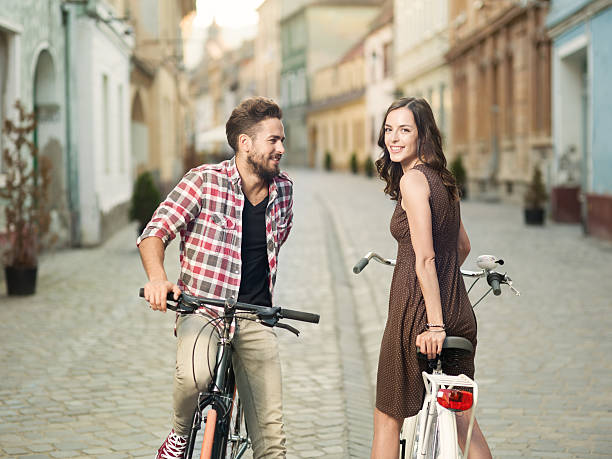 istock casual cyclists stop to smile 515272028